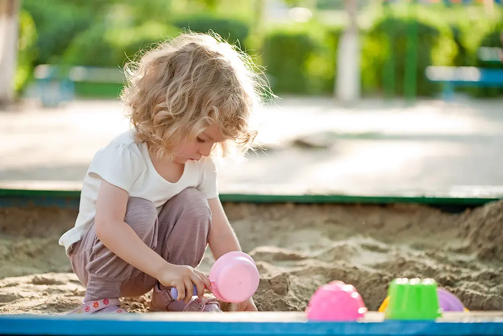 Image of Child playing in a sandpit