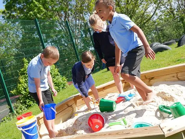 Schoolkids in Sandpit