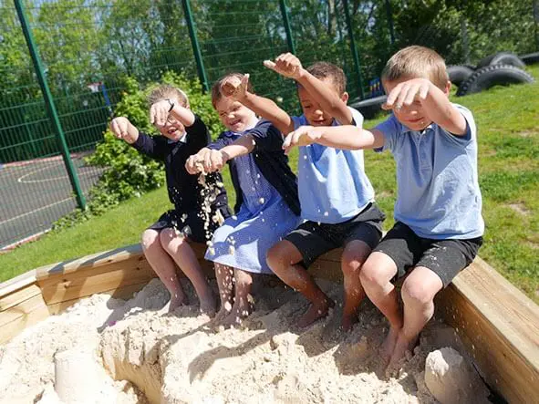 Schoolkids in Sandpit